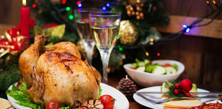 christmas-table-served-with-turkey-decorated-with-bright-tinsel-candles-2